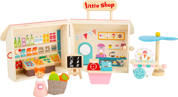 Einkaufsladen mit Koffer